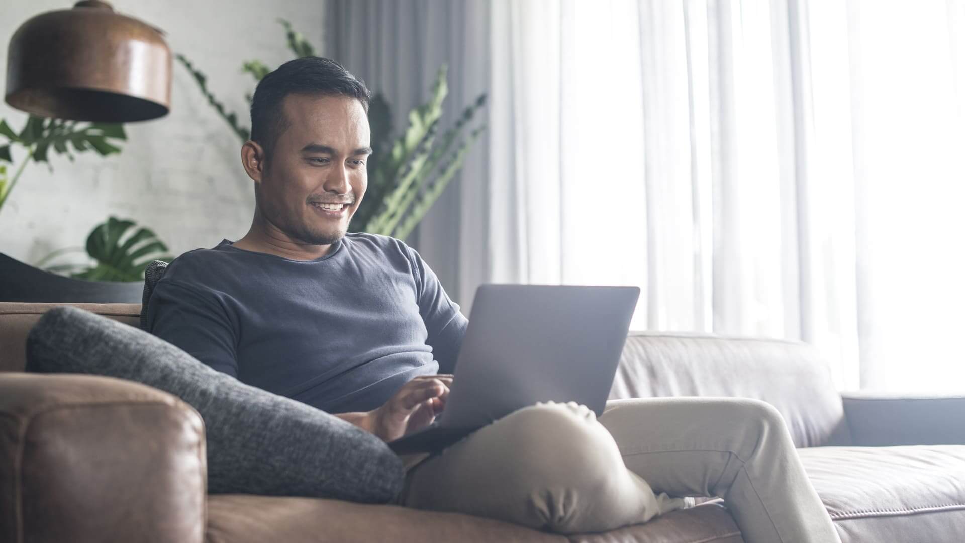 man in home on laptop