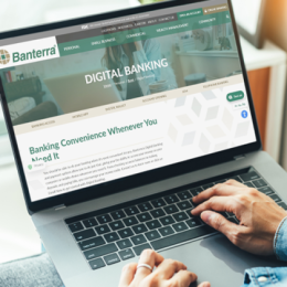 Image shows individual viewing Banterra's Digital Banking page on laptop