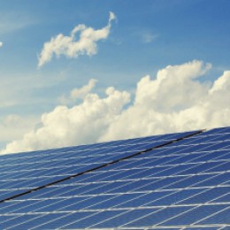 Solar Loans Make Solar Energy for Home or Business Affordable. Solar Panels Facing a Partly Cloudy Sky