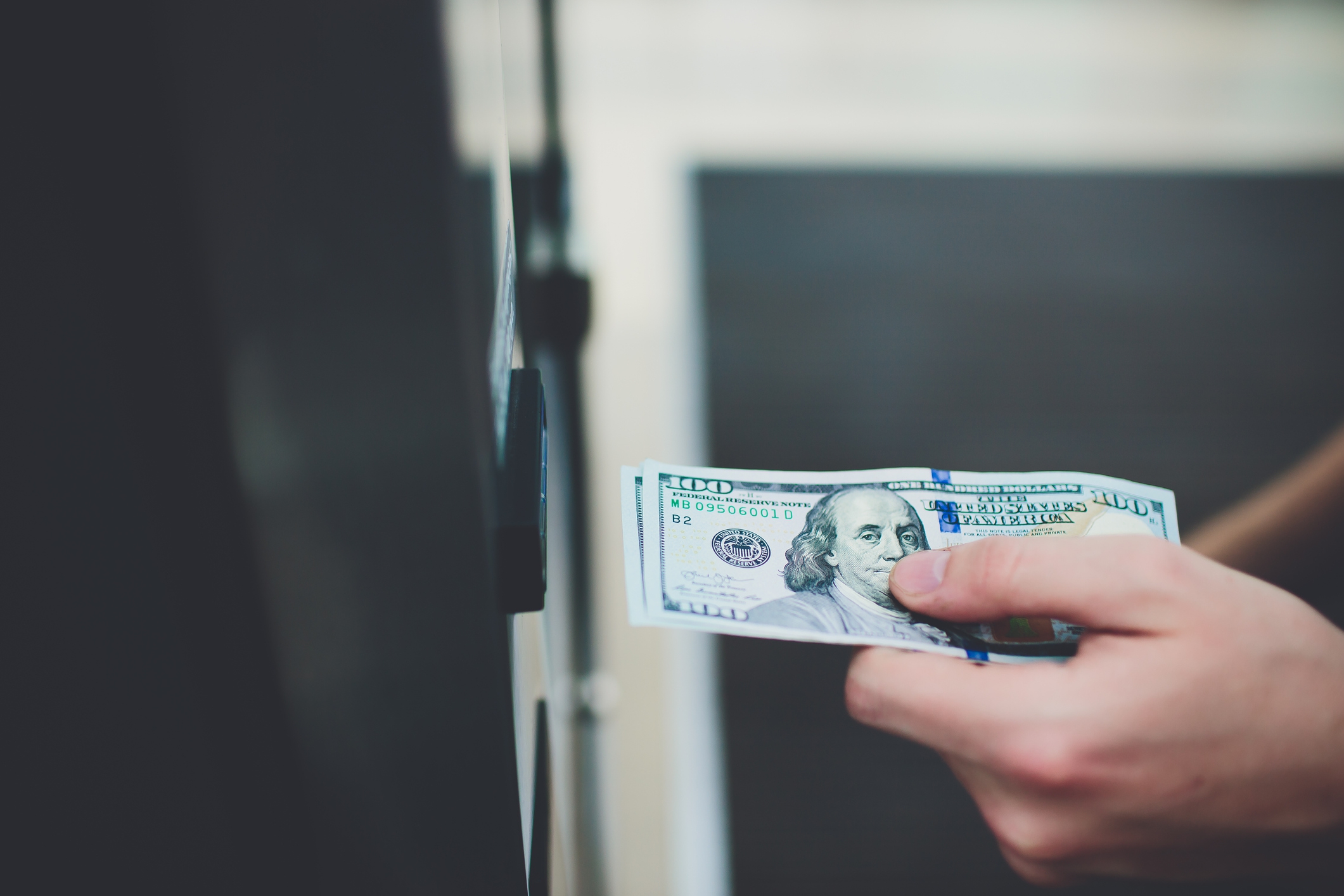 Person depositing money at the bank