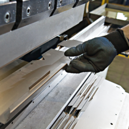 Man's hand using machine equipment.