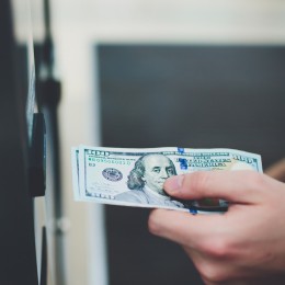 Person depositing money at the bank