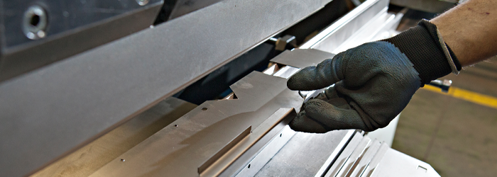Man's hand using machine equipment.