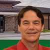 img of Greg Cruse with building behind