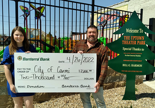 Banterra team member presenting a donation to the City of Carmi, Illinois