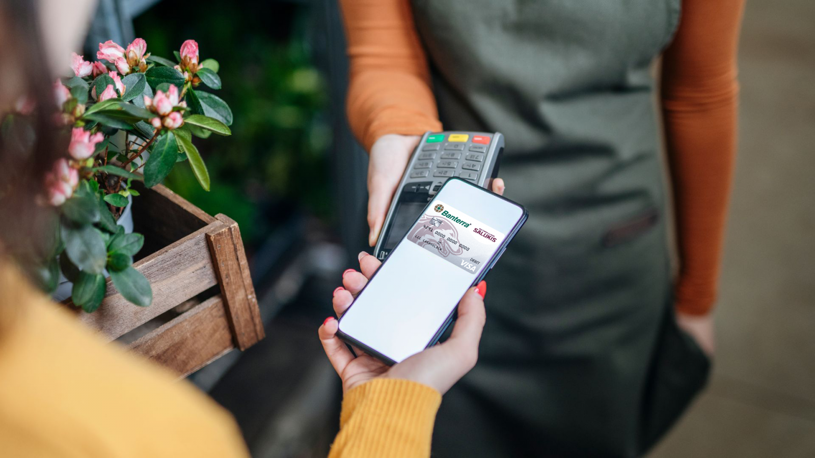 woman using digital wallet with Banterra SIU Saluki debit card added.