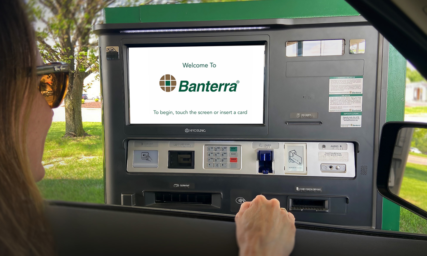 woman using Banterra's ITM screen while in the car