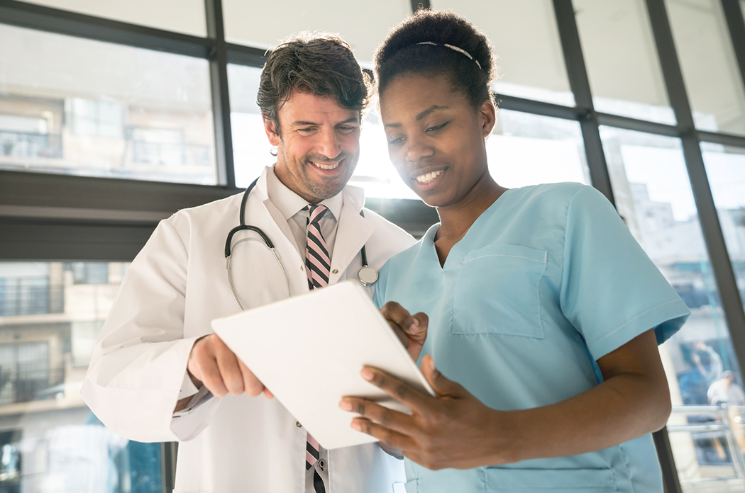 doctor and nurse looking at a chart