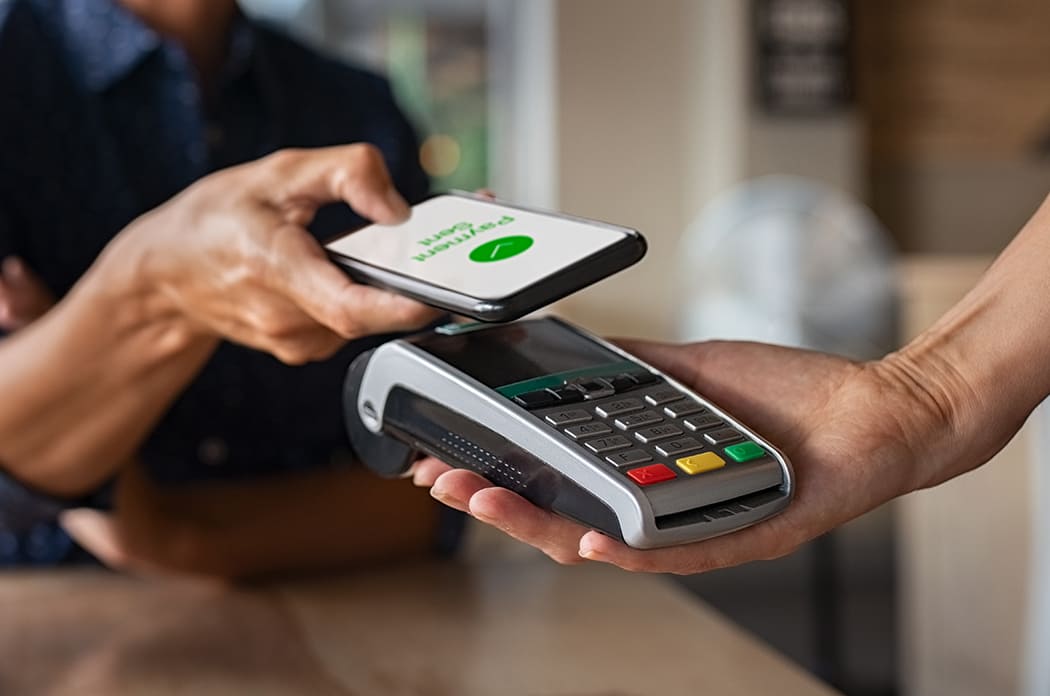 man making a contactless payment with digital wallet