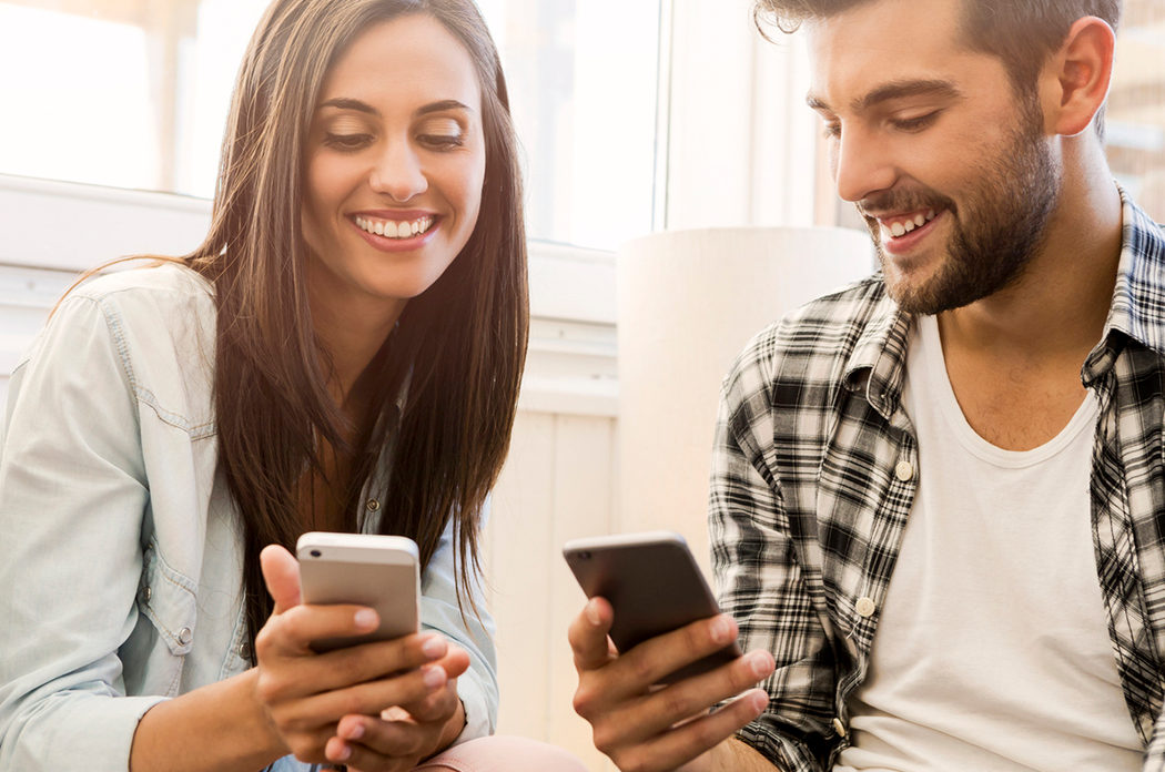 man and woman sending payments with Person-To-Person Payments.