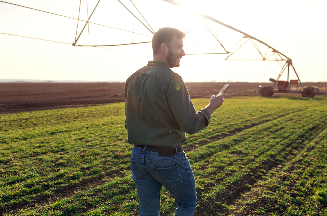 Young male farmer standing in his field in Southern Illinois